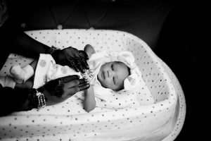 Baby wearing a cozy sleep sack to prevent SIDS and ensure newborn sleep safety.