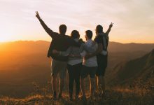 Phone free teens laughing and connecting face to face outdoors