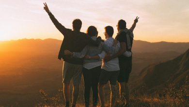Phone free teens laughing and connecting face to face outdoors