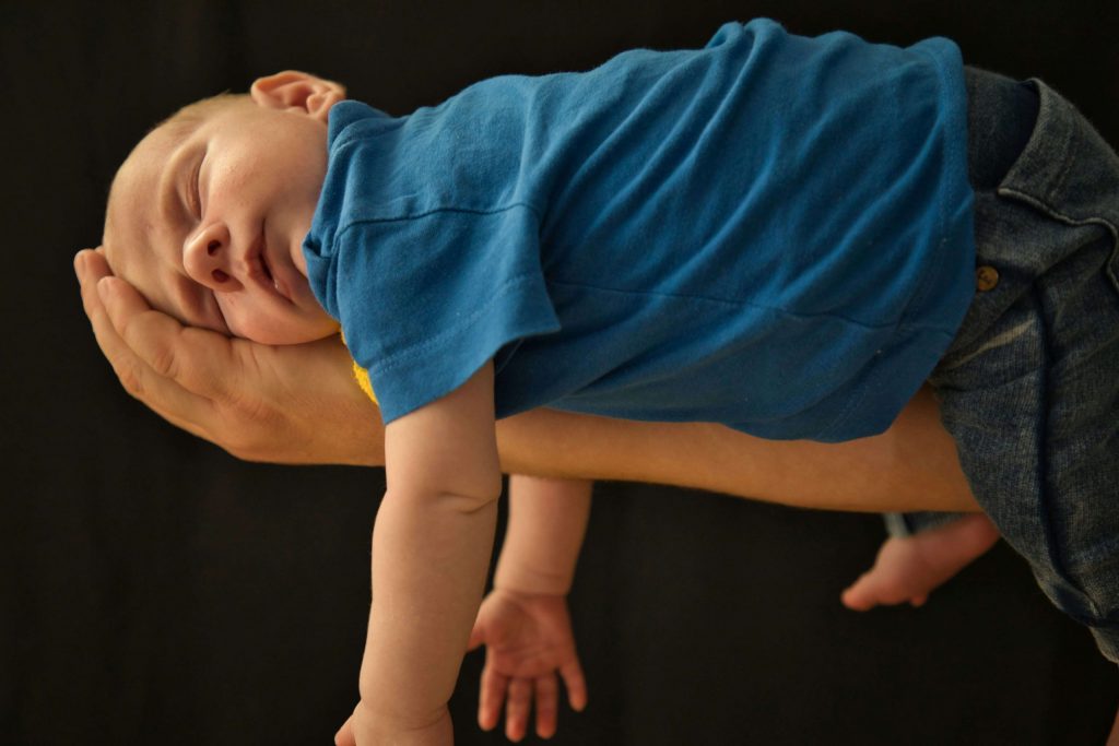 Parent using pick up put down method for baby won't sleep unless held sleep training