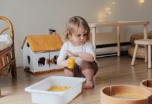 sensory play ideas for toddlers child playing with kinetic sand at home