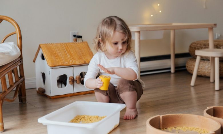sensory play ideas for toddlers child playing with kinetic sand at home