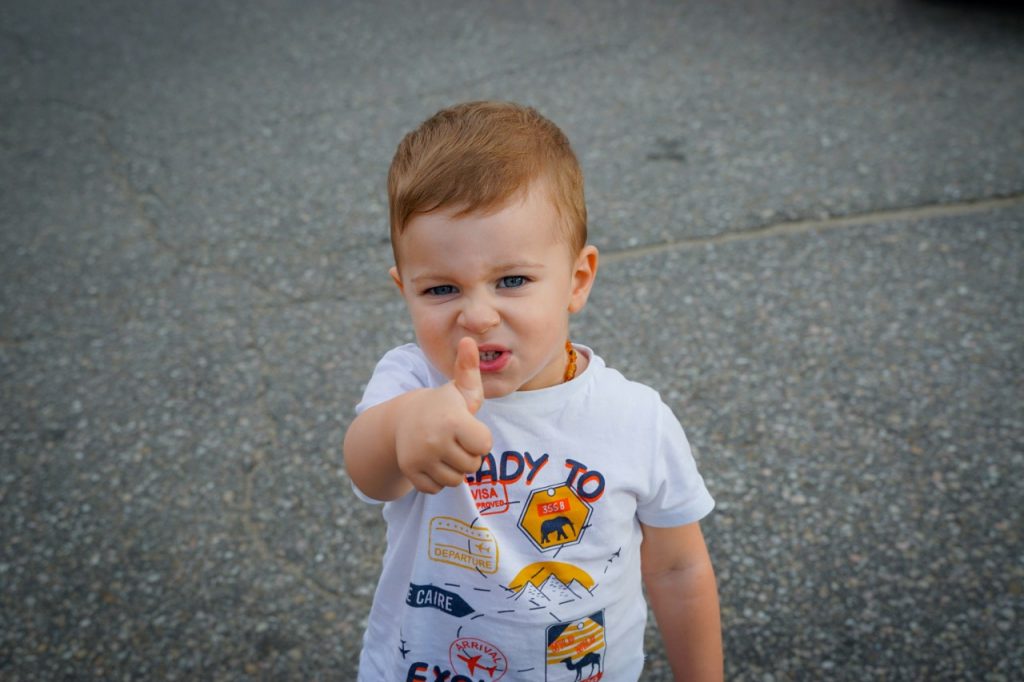 toddler using gestures instead of words —
speech delay sign at 18 months