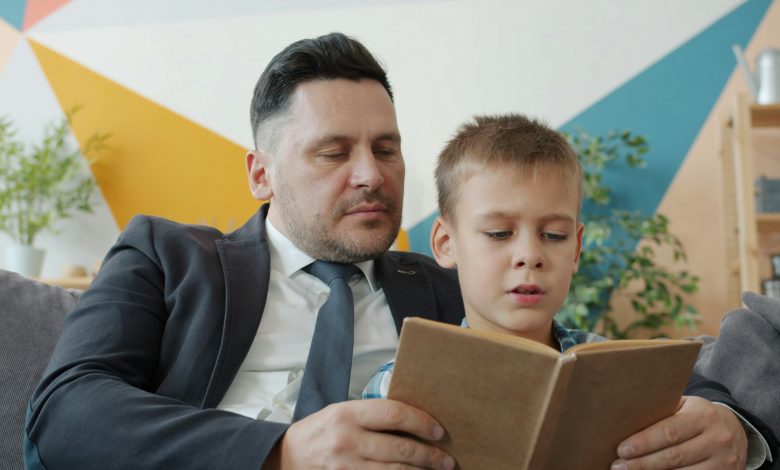 toddler speech delay signs mother reading with 18 month old child at home