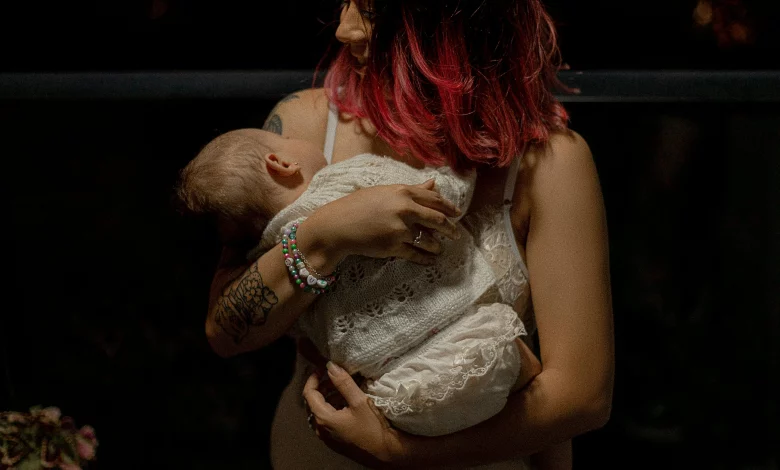 5 month old won't sleep unless held at night