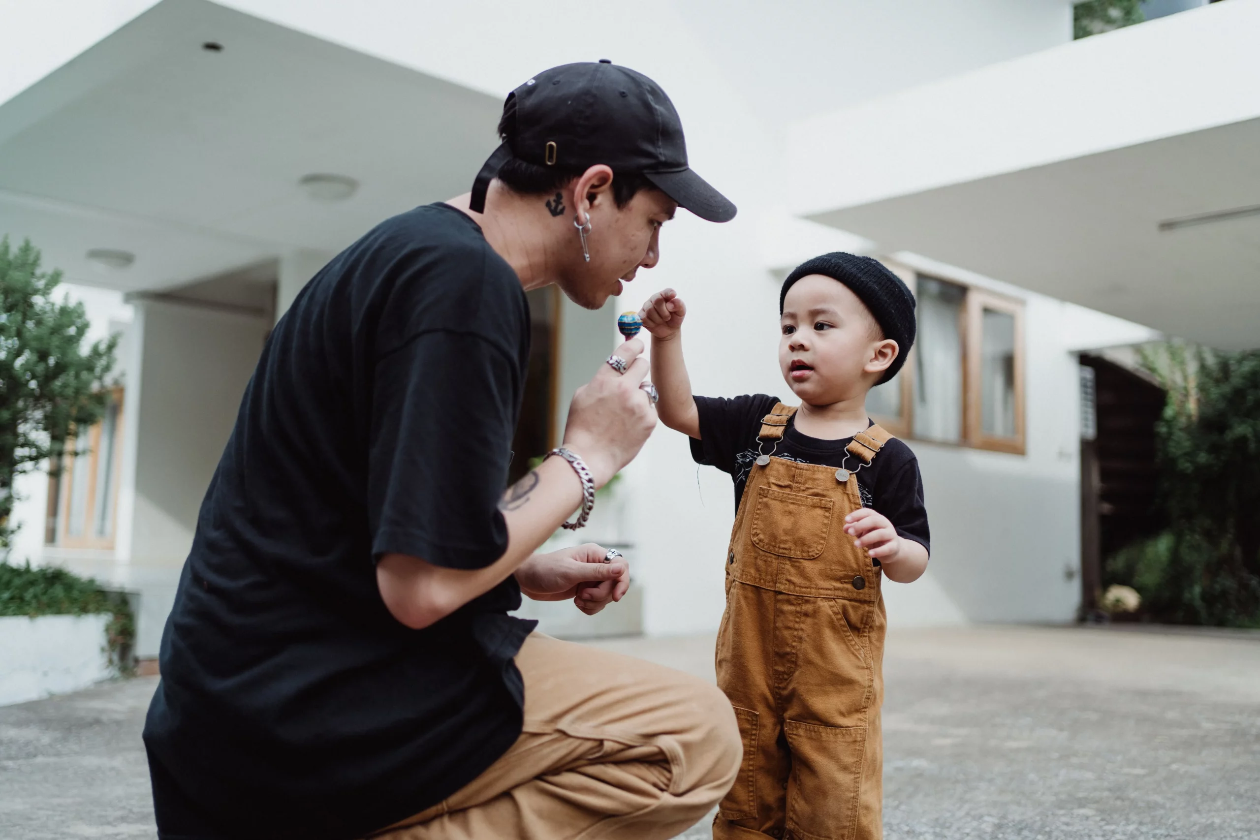 Parent teaching toddler hitting and biting replacement behaviors using calm communication.