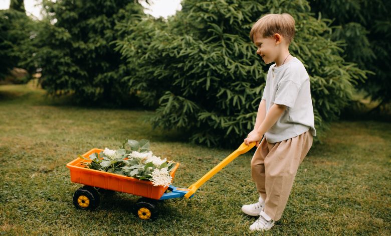 toddler enjoying simple toddler outdoor activities in a garden