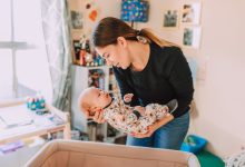 Baby wakes up when parent carefully puts them down in the crib