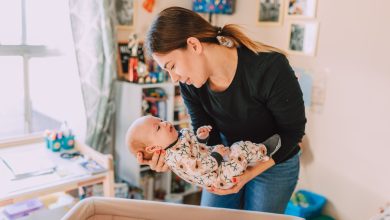 Baby wakes up when parent carefully puts them down in the crib