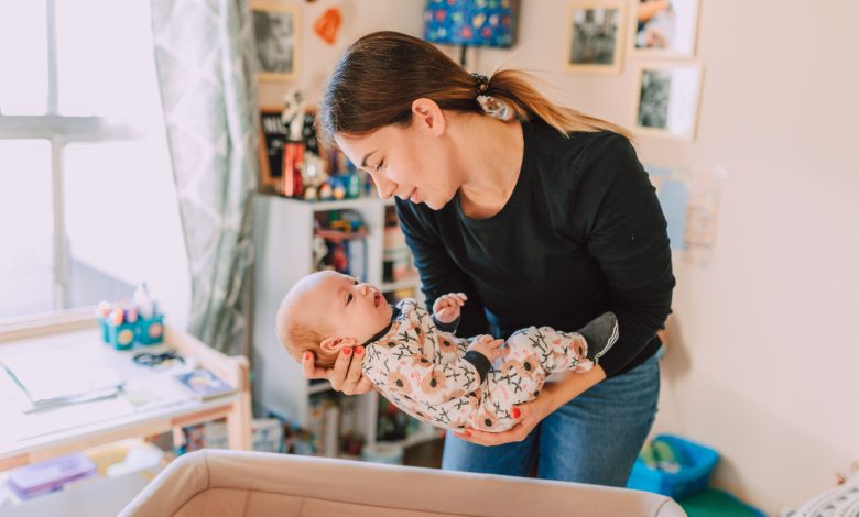 Baby wakes up when parent carefully puts them down in the crib